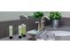 Bathroom sink and eco-friendly toiletries that provide a refreshing and sustainable touch to the space at 2850 Bookmark Dr, Kissimmee, FL 34746