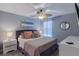Serene bedroom featuring a ceiling fan, dresser, soft color palette, and a comfortable bed for a relaxing retreat at 2850 Bookmark Dr, Kissimmee, FL 34746