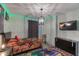 Themed bedroom with twin beds, unique wall decor, and a modern entertainment setup at 2850 Bookmark Dr, Kissimmee, FL 34746