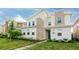Charming two-story home featuring a modern design, stone accents, well-maintained landscaping and a neatly manicured lawn at 2850 Bookmark Dr, Kissimmee, FL 34746
