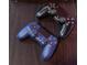 Two Playstation game controllers on a dark surface at 2850 Bookmark Dr, Kissimmee, FL 34746