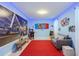 Vibrant game room featuring a Nintendo Switch theme with colorful walls, gaming decor, and a comfortable seating area at 2850 Bookmark Dr, Kissimmee, FL 34746