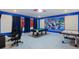 Spacious game room with a pool table, air hockey, and themed decor, perfect for entertaining and leisure activities at 2850 Bookmark Dr, Kissimmee, FL 34746