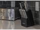 Sleek kitchen counter with stainless steel toaster and knife block against a gray backsplash at 2850 Bookmark Dr, Kissimmee, FL 34746