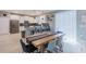 Bright kitchen and dining area featuring a kitchen island with barstool seating, stainless steel appliances, and modern finishes at 2850 Bookmark Dr, Kissimmee, FL 34746