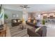 Bright and open living area with contemporary furnishings, a neutral color palette, and a seamless flow into the dining and kitchen areas at 2850 Bookmark Dr, Kissimmee, FL 34746