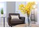 Cozy living area with chair, pillows, and plants provides a comfortable and inviting space for relaxation and socializing at 2850 Bookmark Dr, Kissimmee, FL 34746