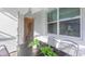 Outdoor patio area with dining table and chairs, along with convenient access to a half bath at 2850 Bookmark Dr, Kissimmee, FL 34746