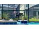 Close-up view of the spa's water feature with outdoor kitchen in the background, as seen from inside the screen at 2850 Bookmark Dr, Kissimmee, FL 34746