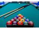 Close up view of a pool table with the balls racked and ready to play at 2850 Bookmark Dr, Kissimmee, FL 34746