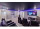A home theater room with comfortable seating and a large screen creates an ideal space for movie nights and entertainment at 2850 Bookmark Dr, Kissimmee, FL 34746