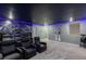 Home theater room featuring comfortable seating, a large screen, and themed decor for movie nights at 2850 Bookmark Dr, Kissimmee, FL 34746