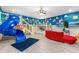 The whimsical ' bedroom is Toy Story themed, featuring a built-in bunk bed and a blue slide at 2907 Fable St, Kissimmee, FL 34746
