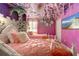 A princess themed bedroom with two twin beds, floral décor and unique castle turret design at 2907 Fable St, Kissimmee, FL 34746