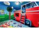 Fire truck themed bedroom with bunk bed and Paw Patrol accents, designed as an imaginative and playful space at 2907 Fable St, Kissimmee, FL 34746