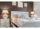 Relaxing bedroom showcasing a queen-sized bed with elegant decor and decorative wall art at 2907 Fable St, Kissimmee, FL 34746