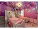 A princess themed bedroom with two twin beds, floral décor and unique castle turret design at 2907 Fable St, Kissimmee, FL 34746
