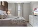Cozy bedroom featuring a queen bed, soft lighting, and a relaxing atmosphere at 2907 Fable St, Kissimmee, FL 34746