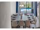 Stylish dining area overlooking the pool with modern light fixture at 2907 Fable St, Kissimmee, FL 34746