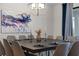 Elegant dining room with a modern chandelier and seating for ten at 2907 Fable St, Kissimmee, FL 34746