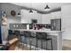 Stylish kitchen featuring a quartz countertop, stainless appliances, and modern pendant lighting at 2907 Fable St, Kissimmee, FL 34746