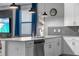 Modern kitchen with stainless steel appliances and a sleek island with seating at 2907 Fable St, Kissimmee, FL 34746