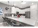Modern kitchen with white cabinets, stainless steel appliances, and a spacious quartz countertop at 2907 Fable St, Kissimmee, FL 34746