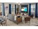 Open concept living space featuring modern furniture and a bright, airy atmosphere at 2907 Fable St, Kissimmee, FL 34746