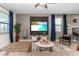 Comfortable living area with stylish decor, modern furniture, and a ceiling fan for climate control at 2907 Fable St, Kissimmee, FL 34746