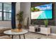 Contemporary living room with a large screen TV displaying a serene beach scene at 2907 Fable St, Kissimmee, FL 34746