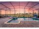 Screened pool with a basketball hoop, chairs and an incredible view at 2907 Fable St, Kissimmee, FL 34746