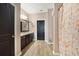 Well-lit bathroom with wood flooring, double vanity, and a decorative shower curtain at 311 Eaglecrest Dr, Haines City, FL 33844