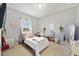 Bright bedroom with a window, desk, and decorations creating a cozy and inviting space at 311 Eaglecrest Dr, Haines City, FL 33844