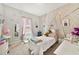 Charming bedroom with whimsical decor and a canopy bed perfect for dreams and playtime at 311 Eaglecrest Dr, Haines City, FL 33844