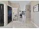 Hallway featuring marble-look tile floors and views into other rooms at 311 Eaglecrest Dr, Haines City, FL 33844