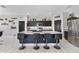 Open kitchen with large island, stainless steel appliances, and dark wood cabinetry at 311 Eaglecrest Dr, Haines City, FL 33844
