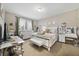 Bedroom with carpeted floors, neutral colored walls, a vanity, and coordinated decor and furnishings at 311 Eaglecrest Dr, Haines City, FL 33844