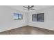 A bedroom with a ceiling fan and two windows at 3153 Greenwood St # Winter Spr, Winter Park, FL 32792