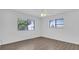 Bright bedroom with hardwood floors, a ceiling fan, and a large window at 3153 Greenwood St # Winter Spr, Winter Park, FL 32792