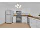 Bright kitchen featuring white cabinetry, stainless steel appliances, and tile floors at 3153 Greenwood St # Winter Spr, Winter Park, FL 32792
