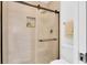 Modern shower with glass door, rainfall shower head, and tiled walls at 3153 Greenwood St # Winter Spr, Winter Park, FL 32792