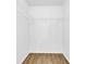 Walk-in closet with hanging racks and wood floor at 3153 Greenwood St # Winter Spr, Winter Park, FL 32792
