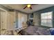 Bright bedroom with wood-look floors, closet, and natural light at 316 Bennett St, Auburndale, FL 33823