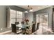 Elegant dining room with modern table, chairs, and natural light from large windows at 316 Bennett St, Auburndale, FL 33823