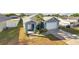 Charming home with well-manicured lawn, walkway, and a driveway leading to a garage at 316 Bennett St, Auburndale, FL 33823