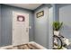 Inviting foyer with stylish flooring, a decorated white front door, and elegant décor at 316 Bennett St, Auburndale, FL 33823