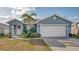 Charming single-story home with a well-maintained lawn and inviting front entrance at 316 Bennett St, Auburndale, FL 33823