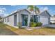 Beautiful single-story home featuring a well-kept lawn, attractive landscaping, and a 2-car garage at 316 Bennett St, Auburndale, FL 33823