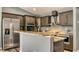 Modern kitchen with stainless steel appliances, granite countertops, and updated cabinetry at 316 Bennett St, Auburndale, FL 33823