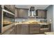 Stylish kitchen with stainless steel appliances, granite countertops, and modern cabinetry at 316 Bennett St, Auburndale, FL 33823
